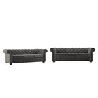 Divano Chesterfield Gdansk con braccioli arrotolati trapuntati