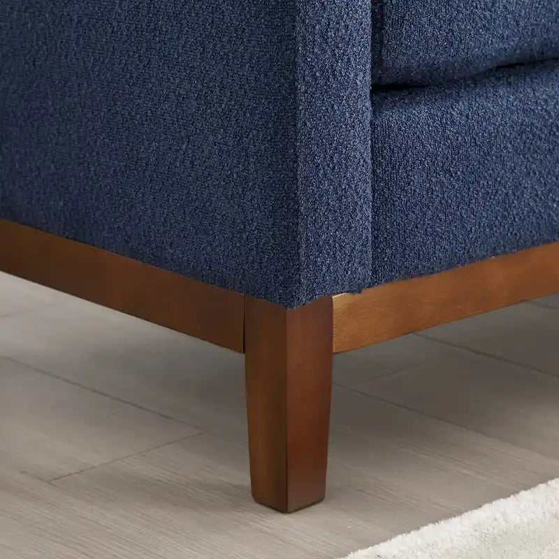 Elegante panca imbottita, con gambe in legno