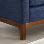 Elegante panca imbottita, con gambe in legno