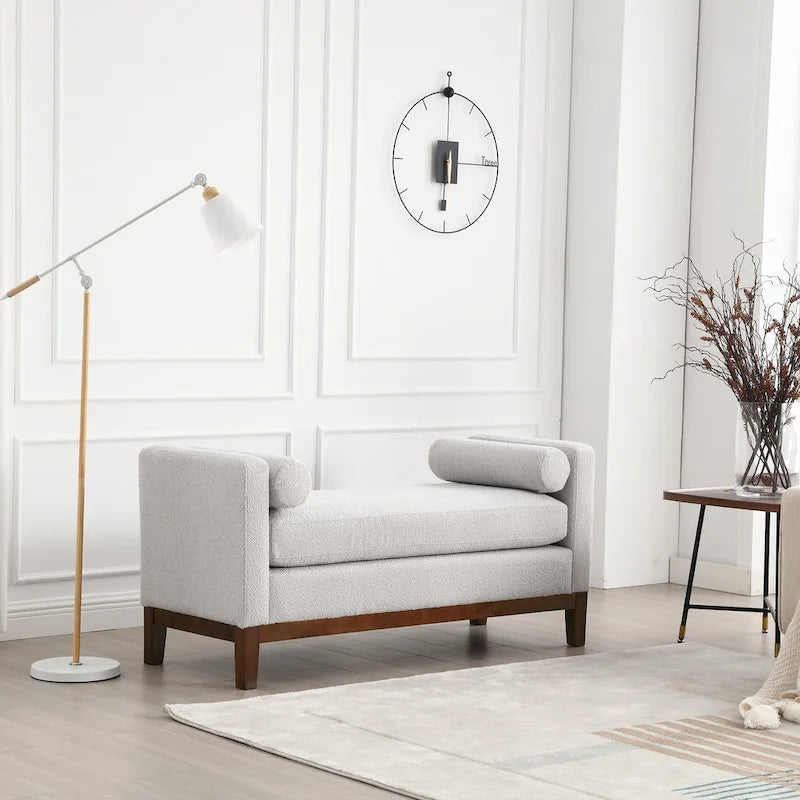 Elegante panca imbottita, con gambe in legno