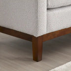 Elegante panca imbottita, con gambe in legno