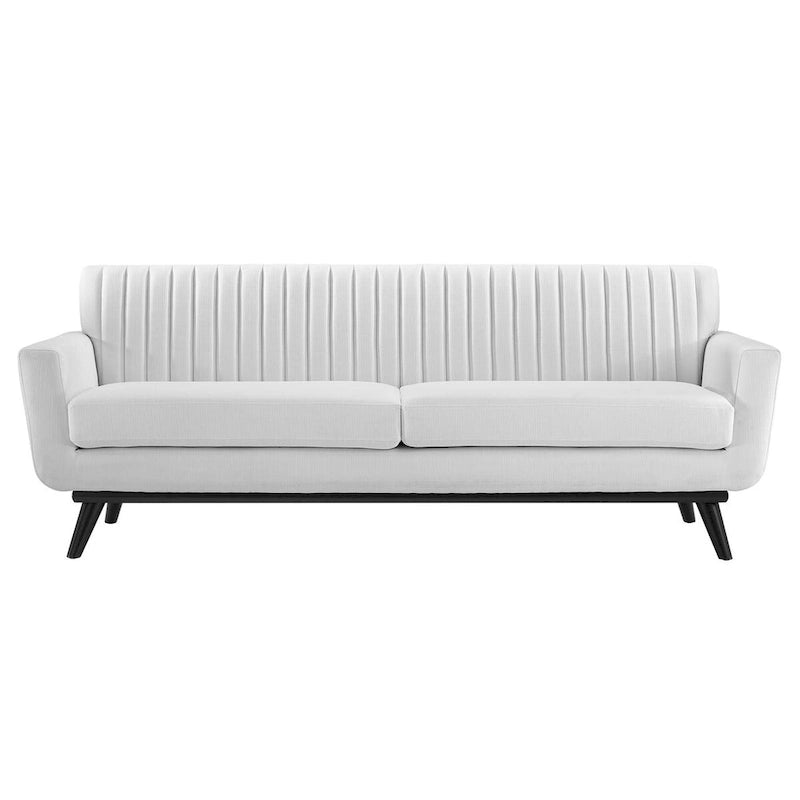 Divano in tessuto capitonné